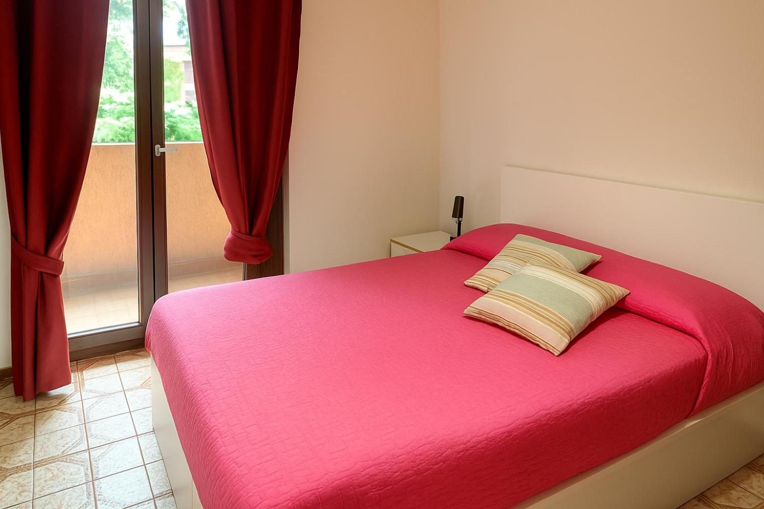 The double bedroom, with the French window onto the balcony