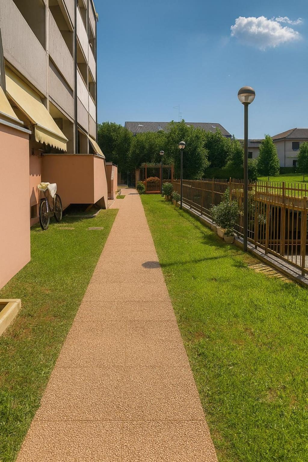 The path between the lawn and the building