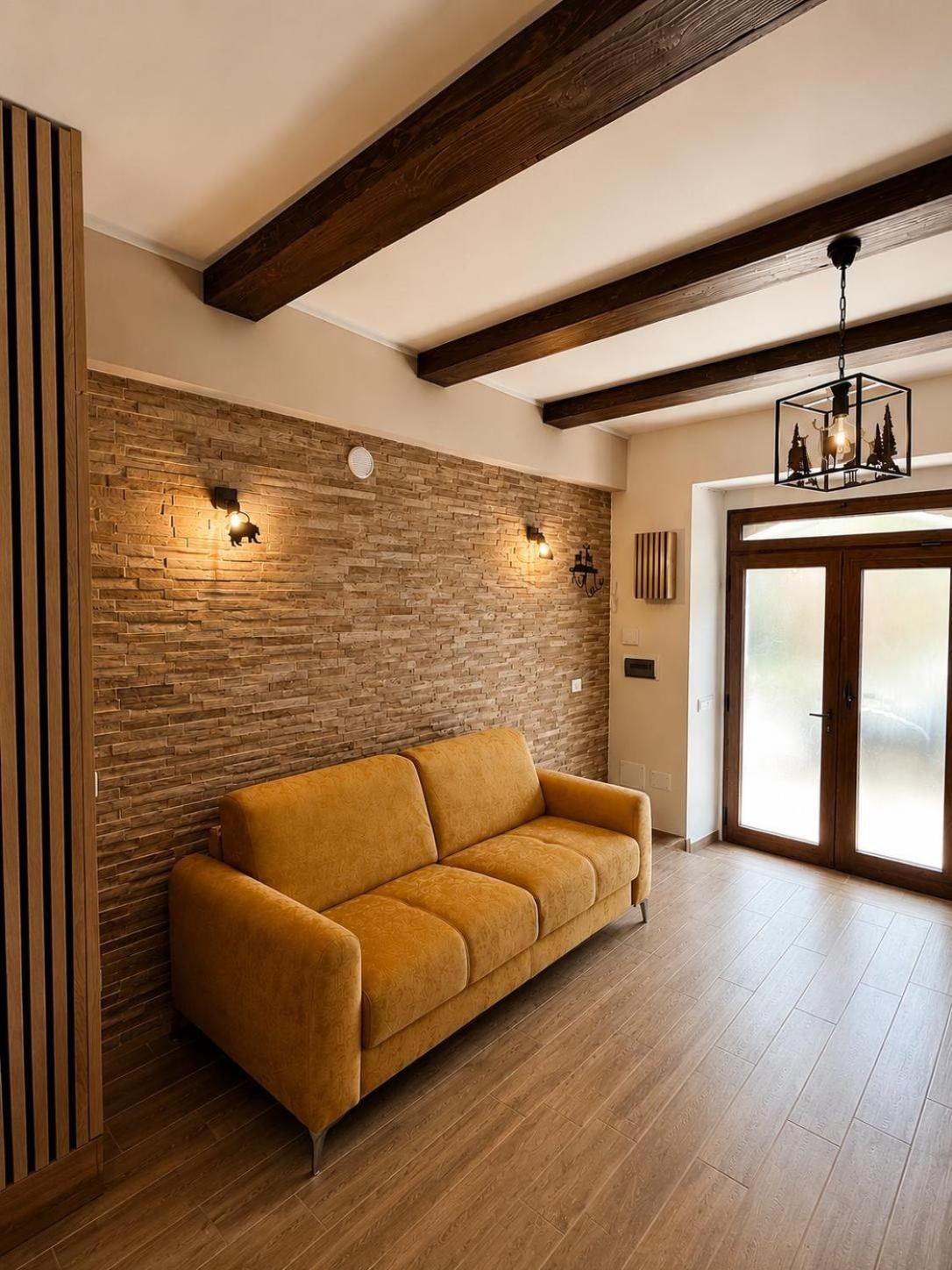 The living room with the sofa and the French window